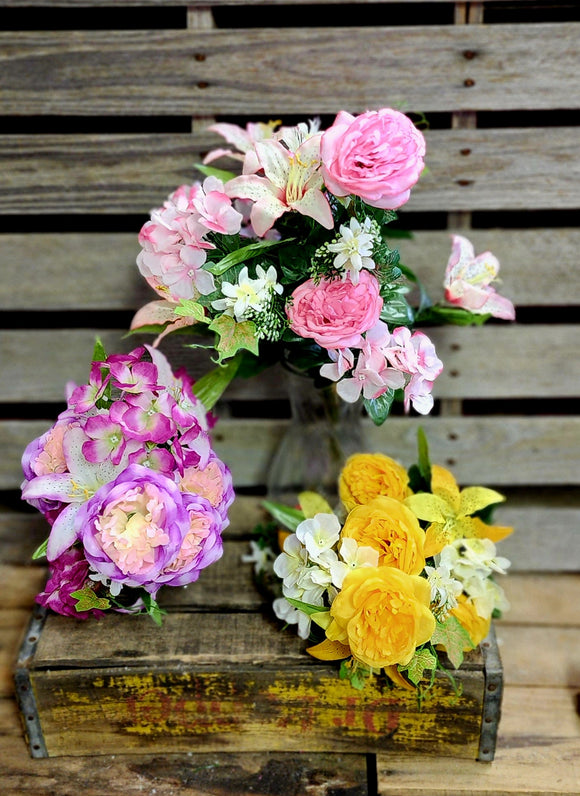 Mixed lily and rose bush