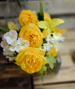 Mixed lily and rose bush